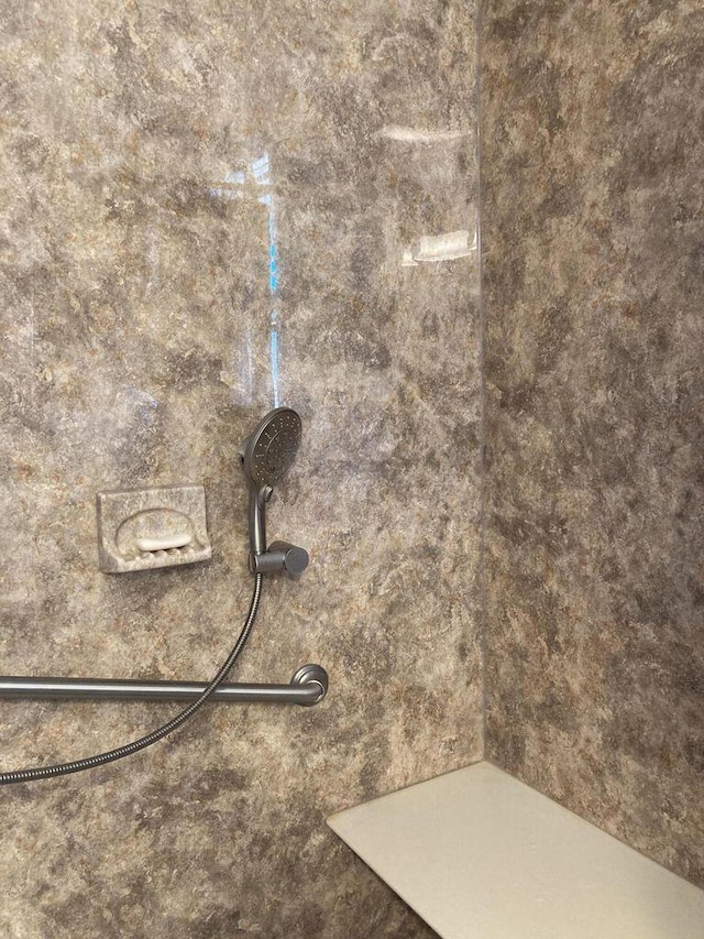 details featuring a tile shower