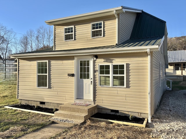 view of front of house featuring crawl space and metal roof