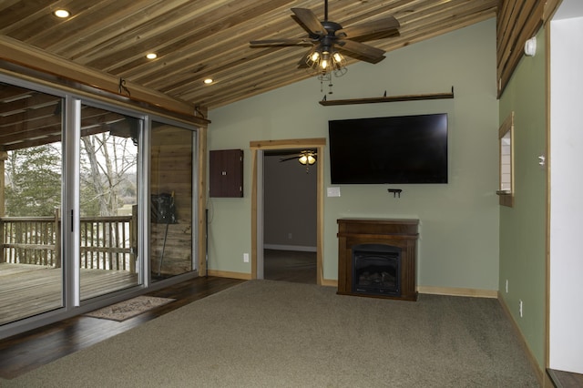 unfurnished living room with ceiling fan, a fireplace, baseboards, and vaulted ceiling