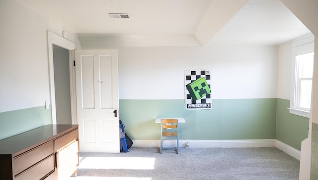 unfurnished room featuring carpet floors, visible vents, and baseboards
