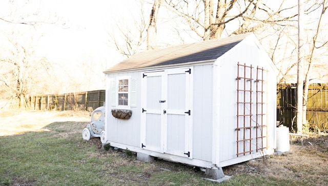 view of shed with fence