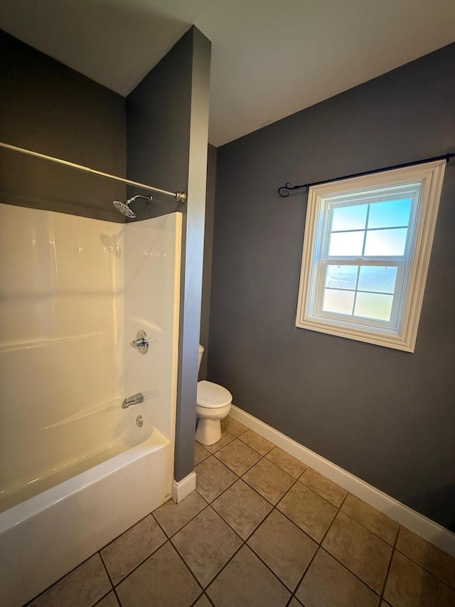 full bath featuring toilet, tile patterned flooring, shower / tub combination, and baseboards