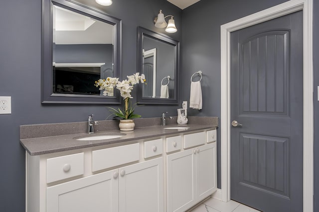 full bathroom featuring a sink and double vanity