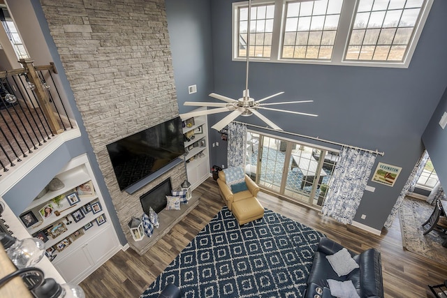 living area with plenty of natural light and wood finished floors