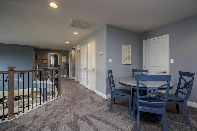 carpeted dining space featuring recessed lighting, visible vents, and baseboards