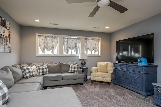 carpeted living room with ceiling fan, visible vents, and recessed lighting