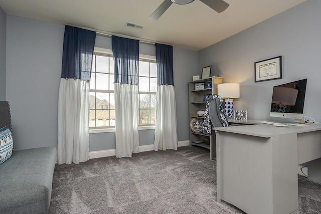 carpeted office featuring visible vents, ceiling fan, and baseboards