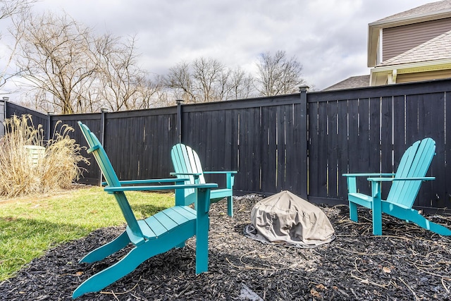 exterior space with a fire pit and a fenced backyard