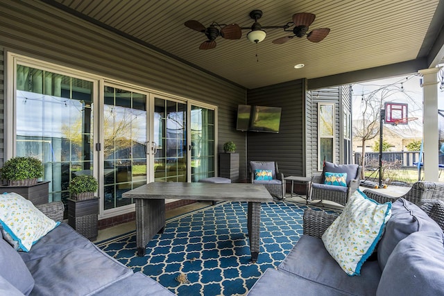 view of patio featuring an outdoor living space and a ceiling fan