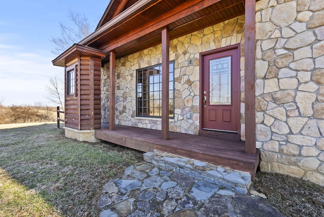 property entrance featuring stone siding