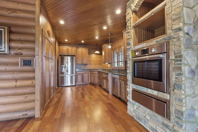 kitchen with appliances with stainless steel finishes, recessed lighting, wood ceiling, and a warming drawer