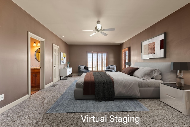 carpeted bedroom featuring a ceiling fan, ensuite bath, and baseboards