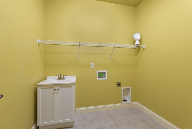 laundry area featuring light tile patterned floors, hookup for an electric dryer, washer hookup, a sink, and cabinet space