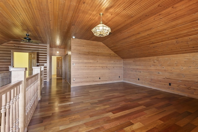 bonus room featuring a chandelier, wood finished floors, wood ceiling, vaulted ceiling, and log walls