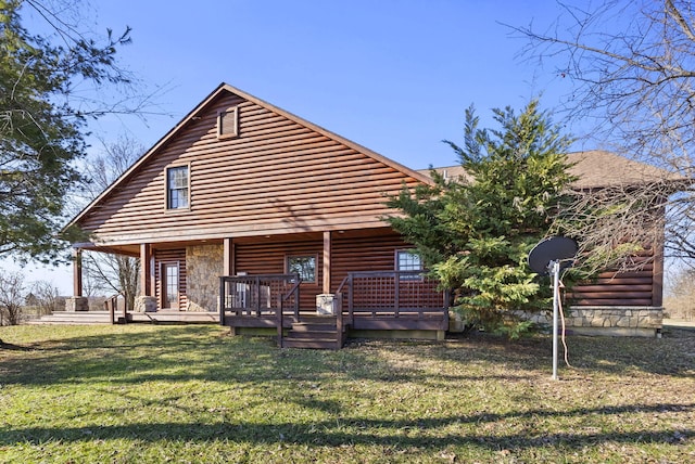 view of front of home featuring a front lawn and log veneer siding