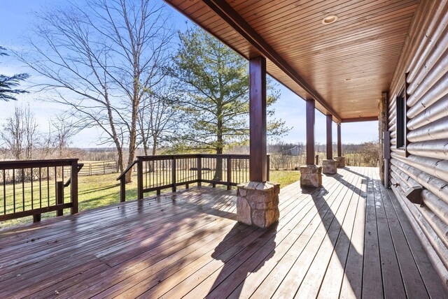 wooden deck featuring a rural view