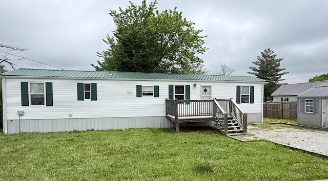 71 Pike St, Brodhead, KY 40409 - manufactured / mobile home featuring a deck, an outdoor structure, and a storage unit