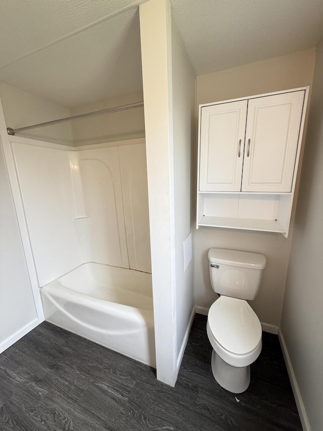 71 Pike St, Brodhead, KY 40409 - full bath with wood finished floors, toilet, baseboards, and a textured ceiling