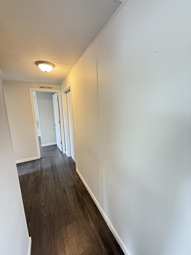 71 Pike St, Brodhead, KY 40409 - corridor with dark wood-style flooring, baseboards, and a textured ceiling