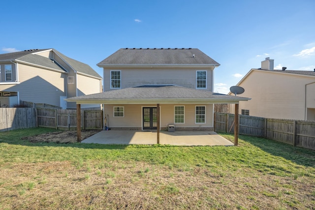 back of house with a patio area, a fenced backyard, french doors, and a yard