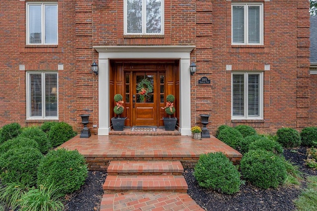 entrance to property with brick siding