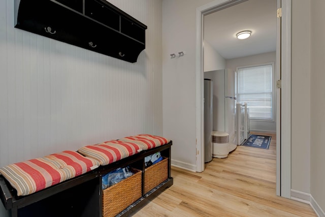 mudroom with light wood-style flooring and baseboards