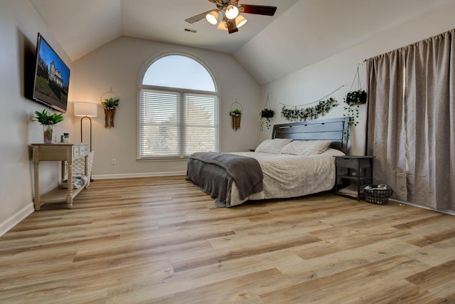 bedroom featuring vaulted ceiling, ceiling fan, wood finished floors, and visible vents