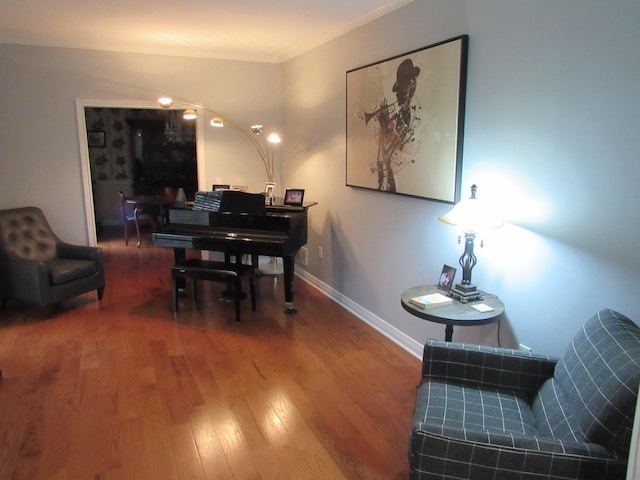 dining area with wood finished floors and baseboards