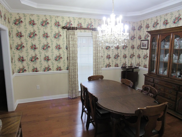 dining room featuring wallpapered walls, a notable chandelier, wood finished floors, and baseboards