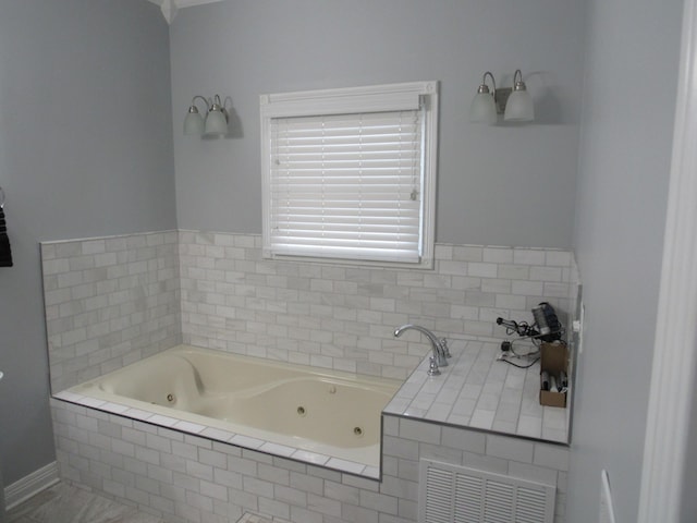 full bath featuring a tub with jets and visible vents