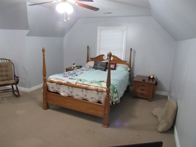 carpeted bedroom with visible vents, baseboards, ceiling fan, and vaulted ceiling