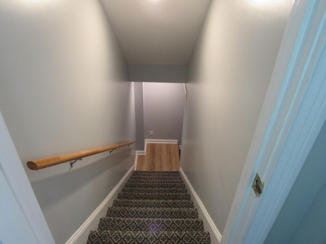 stairs featuring baseboards