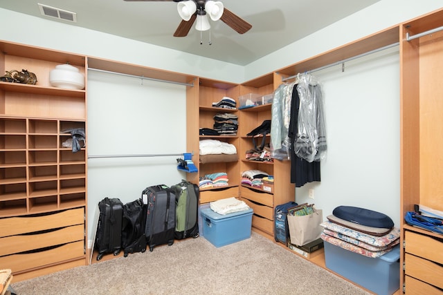 spacious closet featuring ceiling fan and visible vents