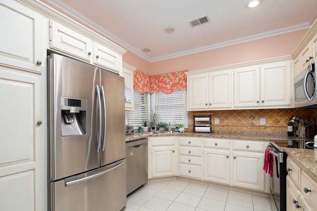 kitchen featuring tasteful backsplash, visible vents, stainless steel appliances, crown molding, and light tile patterned flooring