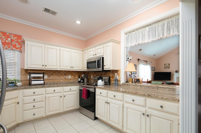 kitchen featuring visible vents, stainless steel appliances, backsplash, and ornamental molding