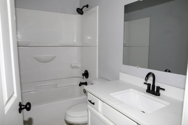 bathroom featuring shower / bath combination, vanity, and toilet