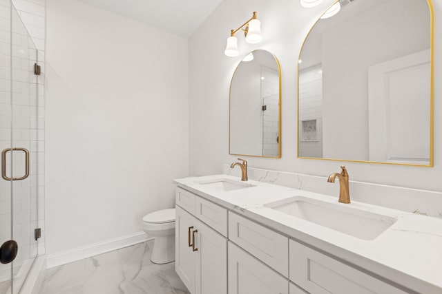 bathroom with toilet, marble finish floor, baseboards, and a sink