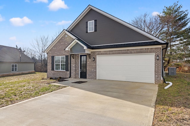 view of front facade featuring a garage, central AC, brick siding, driveway, and a front yard