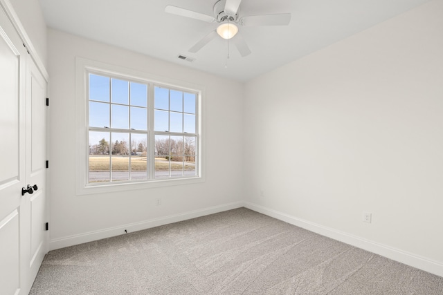 unfurnished bedroom featuring visible vents, baseboards, ceiling fan, carpet floors, and a closet