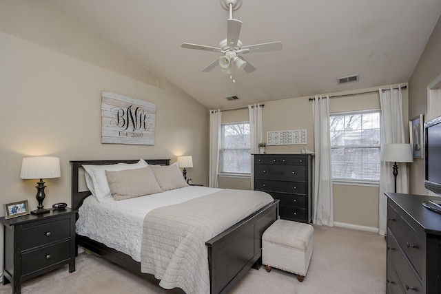 bedroom featuring light carpet, vaulted ceiling, visible vents, and baseboards