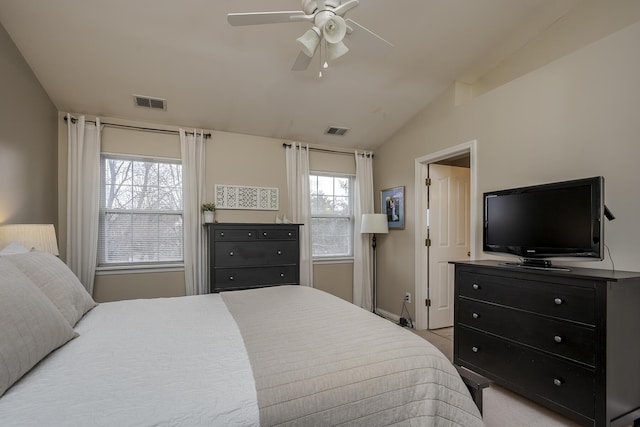 bedroom with lofted ceiling, ceiling fan, visible vents, and baseboards