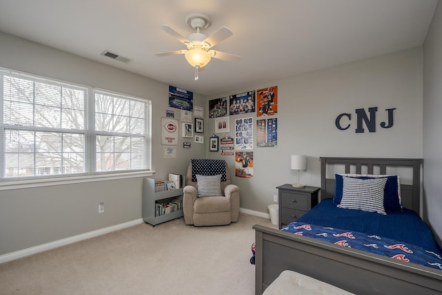 bedroom featuring a ceiling fan, carpet flooring, visible vents, and baseboards