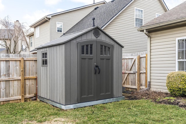 view of shed with fence