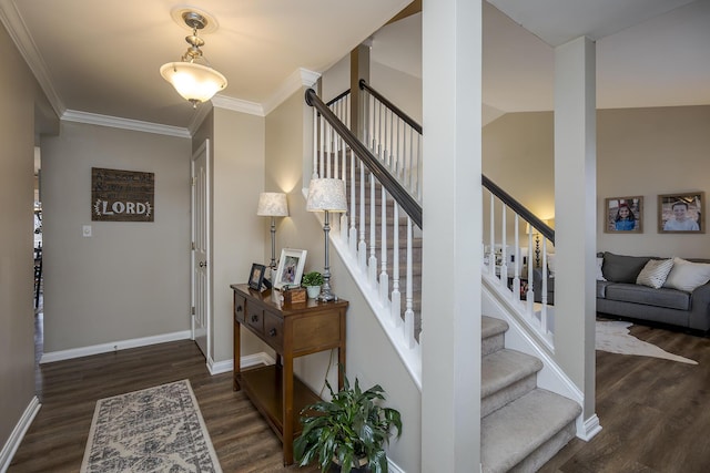 entryway featuring crown molding, stairs, baseboards, and dark wood-style flooring