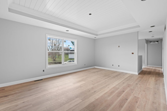 1000 Indian Trl, Lawrenceburg, KY 40342 - unfurnished room with light wood-style floors, a tray ceiling, baseboards, and visible vents