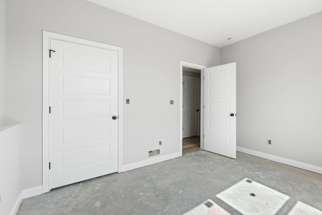 1000 Indian Trl, Lawrenceburg, KY 40342 - unfurnished bedroom with unfinished concrete flooring and baseboards