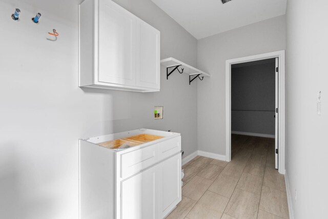 1000 Indian Trl, Lawrenceburg, KY 40342 - interior space with washer hookup, cabinet space, and baseboards