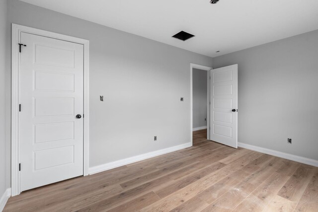 1000 Indian Trl, Lawrenceburg, KY 40342 - unfurnished bedroom featuring light wood-style flooring and baseboards