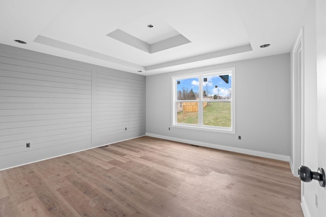 1000 Indian Trl, Lawrenceburg, KY 40342 - empty room featuring a raised ceiling, baseboards, and wood finished floors