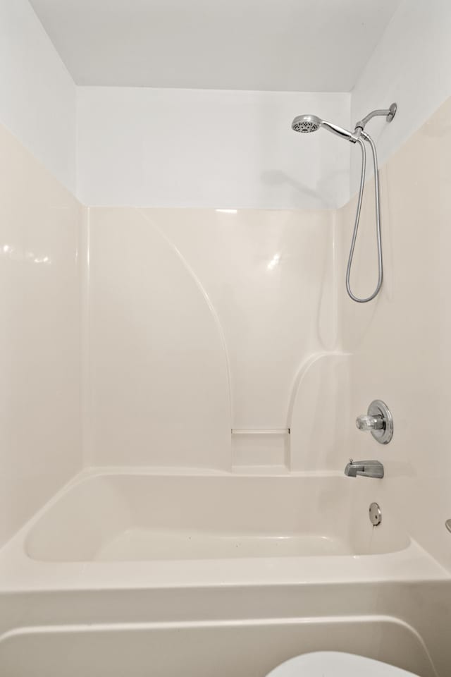 bathroom with washtub / shower combination